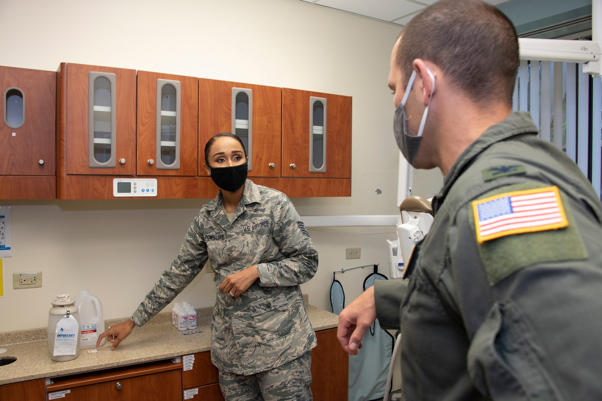 U.S. Air Force Tech. Sgt. Vanessa Powell-Davis, left, 60th Dental Squadron noncommissioned officer in charge of infection control, explains the process of testing dental equipment waterlines for the presence of bacteria to Col. Zachery Jiron, 60th Air Mobility Wing vice commander, during Leadership Rounds June 26, 2020, at David Grant USAF Medical Center, Travis Air Force Base, California. The Leadership Rounds program provides 60th AMW leadership an opportunity to interact with Airmen and get a detailed view of each mission performed at Travis AFB.  (U.S. Air Force photo by Heide Couch)