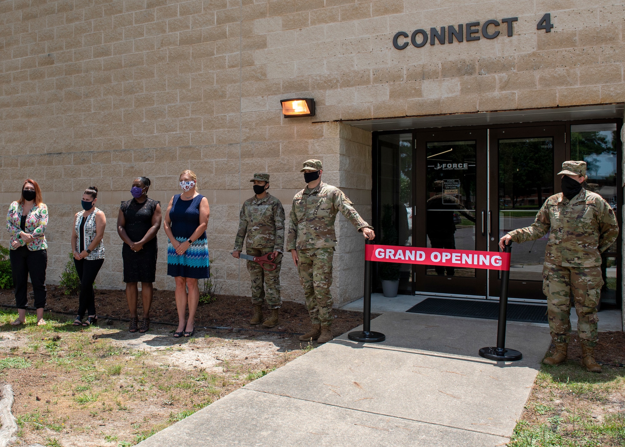 Members of Team Seymour gather for the Connect 4 ribbon cutting ceremony at Seymour Johnson Air Force Base, North Carolina, June 30, 2020.