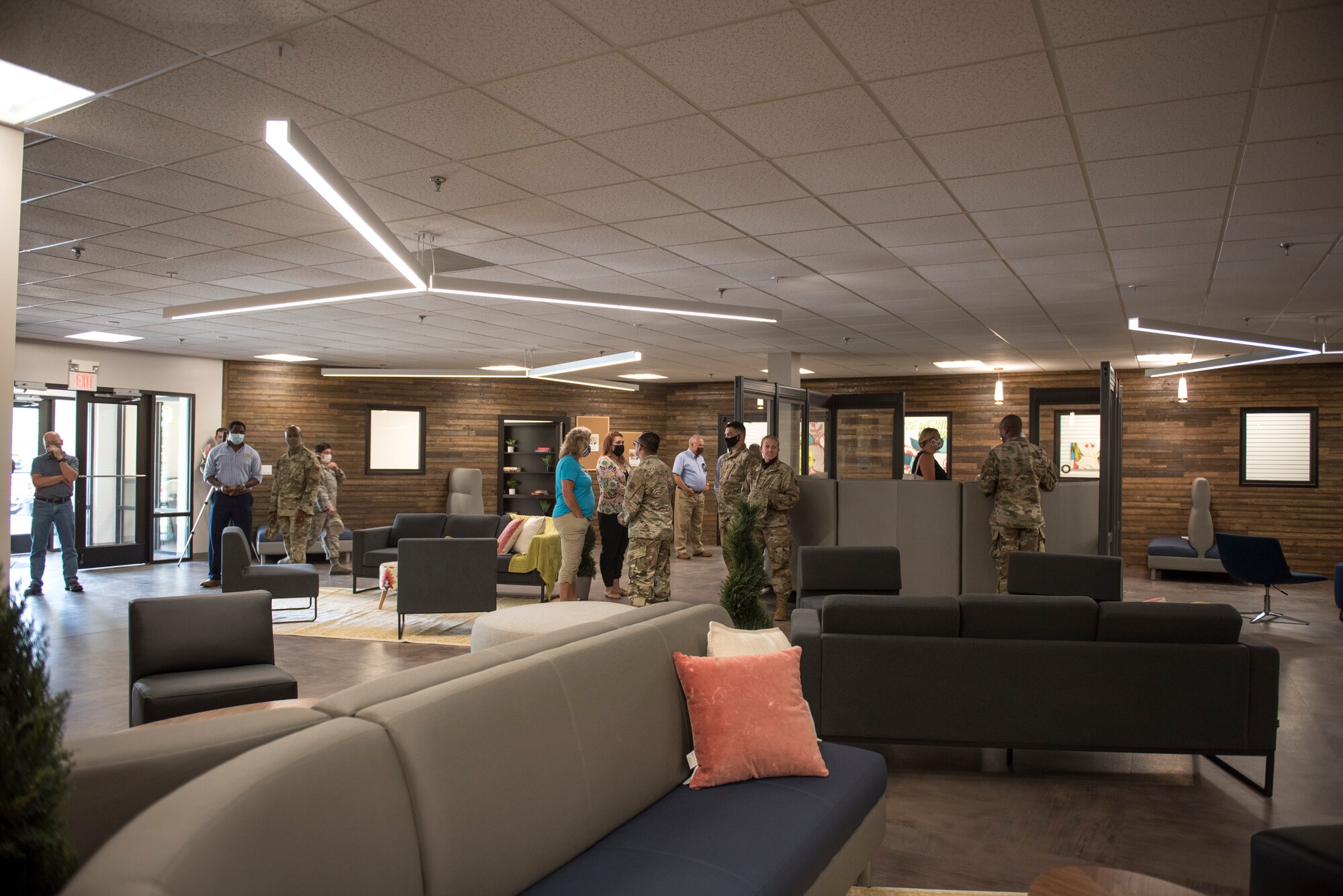 Members of Team Seymour gather in the main room of the new Connect 4 building after the ribbon cutting ceremony at Seymour Johnson Air Force Base, North Carolina, June 30, 2020.