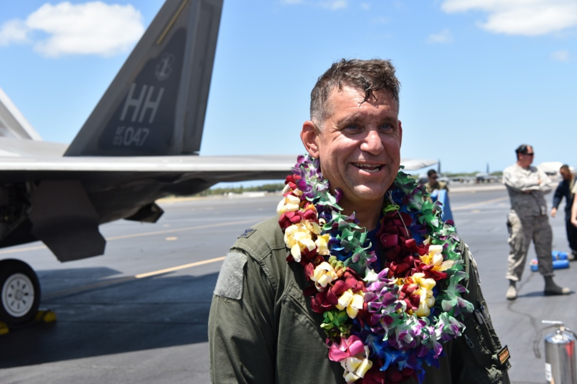 Col. Geoffrey E. Lohmiller, 15th Wing vice commander, receives a lei after landing an F-22 Hawaiian Raptor from his fini flight at Joint Base Pearl Harbor-Hickam, Hawaii, June 26, 2020. A lei is a common symbol of love, friendship, celebration, honor or greeting. Lohmiller, who served as the vice wing commander since May 2018, will retire later this year. (U.S. Air Force photo by Tech. Sgt. Anthony Nelson Jr.)