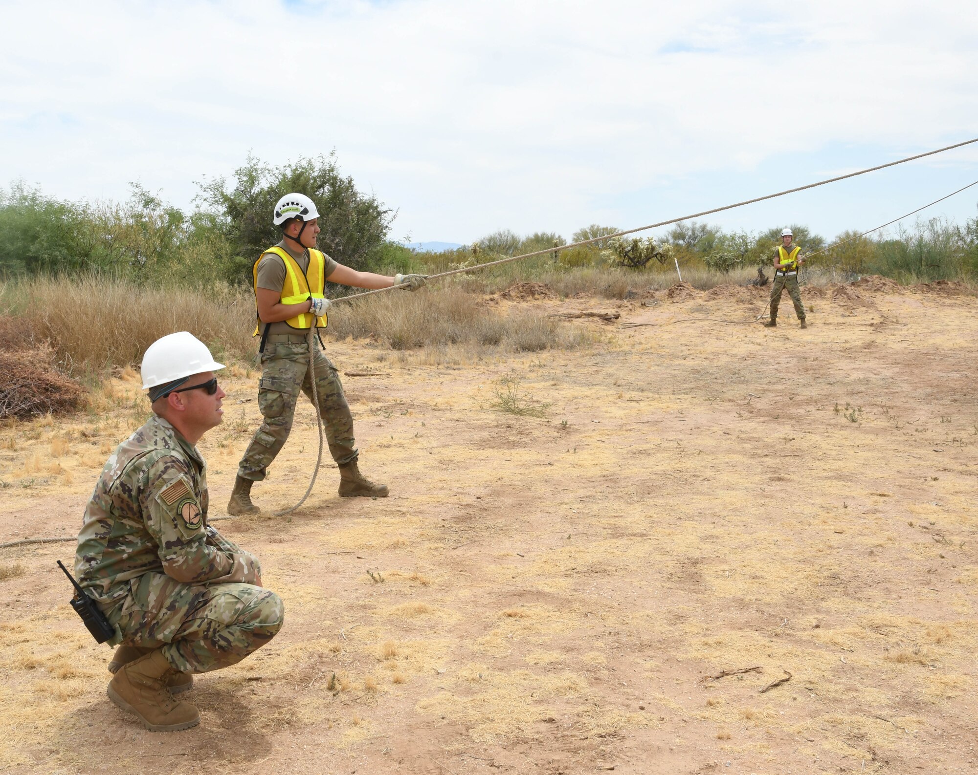 Airman hold a rope.