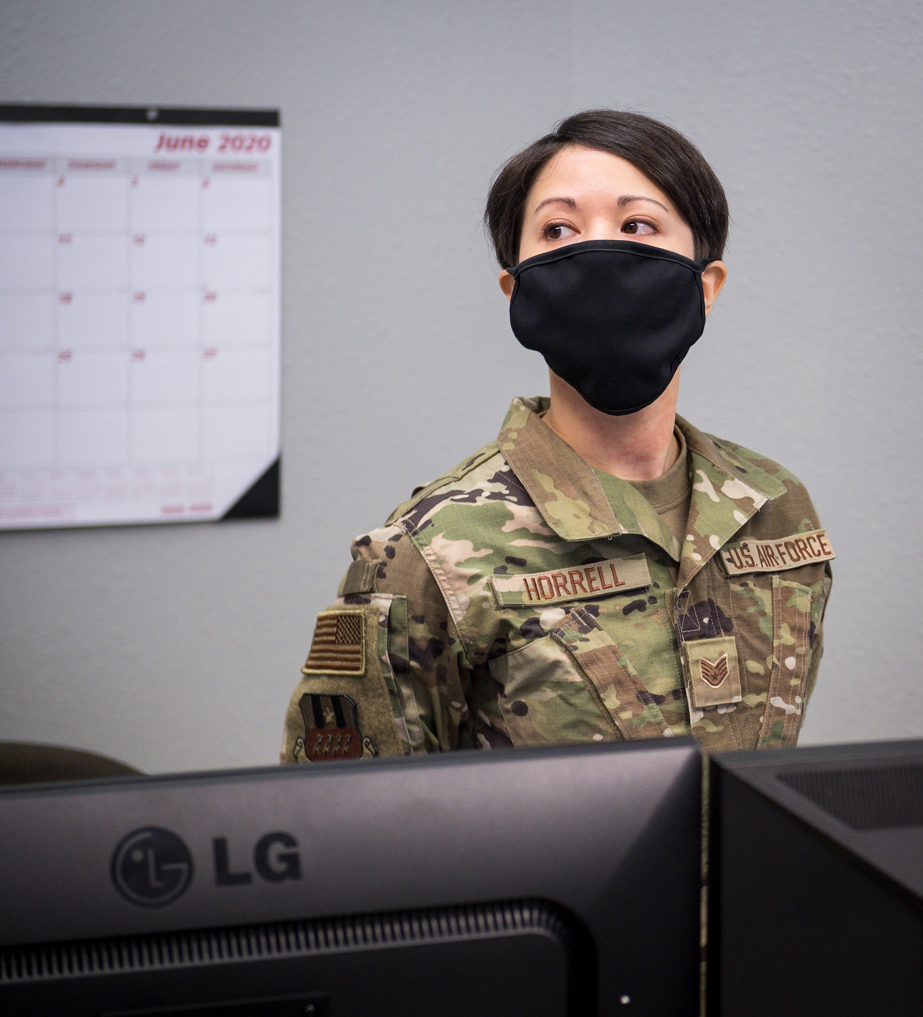 Staff Sgt. Dylana Horrell, 2nd Comptroller Squadron financial operations supervisor, briefs Col. Michael Miller, 2nd Bomb Wing commander, on her role in the new River’s Edge Welcome Center at Barksdale Air Force Base, La., June 29, 2020.