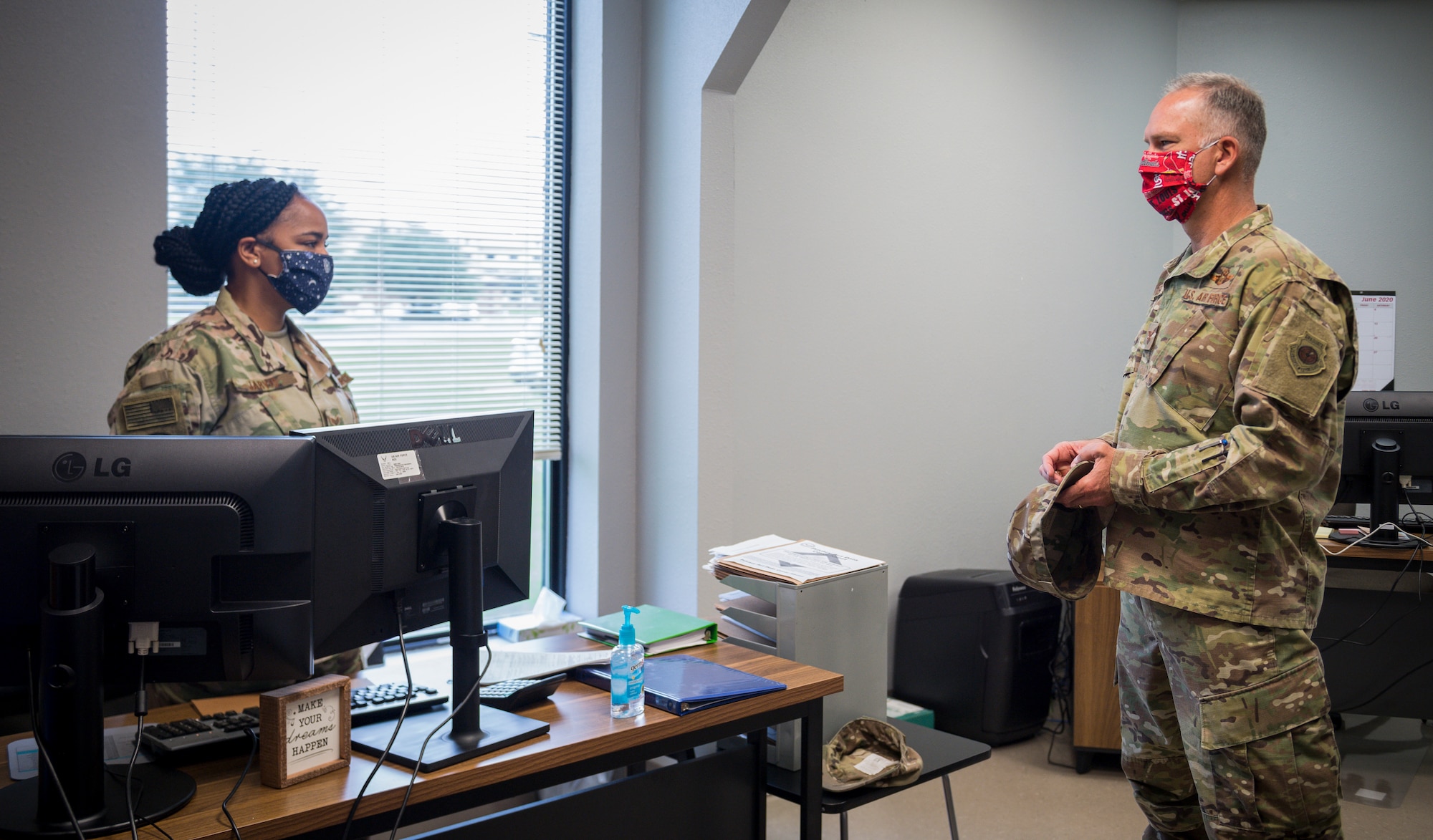 Senior Airman Destiny Jarvis, 2nd Logistics Readiness Squadron traffic management office personal property counselor, briefs Col. Michael Miller, 2nd Bomb Wing commander, on her role in the new River’s Edge Welcome Center  at Barksdale Air Force Base, La., June 29, 2020