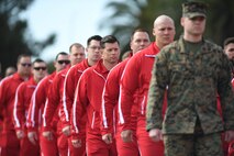 U.S. Marines with Wounded Warrior Battalions East and West march in formation during the opening ceremony of the 2020 Marine Corps Trials on Marine Corps Base Camp Pendleton, California, Feb. 28. The Marine Corps Trials promotes rehabilitation through adaptive sports participation for Recovering Service Members and veterans all over the world. (Official U.S. Marine Corps photo by Lance Corporal Garrett Gillespie)