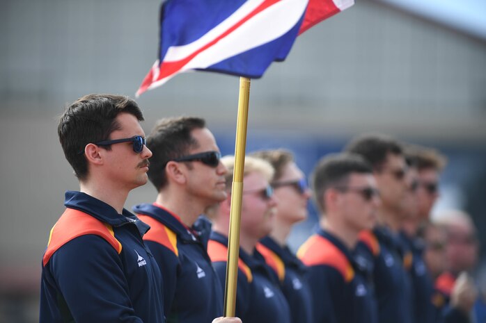 Royal Marines from the United Kingdom (UK) stand at attention during the playing of the UK National Anthem at the opening ceremony of the 2020 Marine Corps Trials on Marine Corps Base Camp Pendleton, California, Feb. 28. The Marine Corps Trials promotes rehabilitation through adaptive sports participation for Recovering Service Members and veterans all over the world. (Official U.S. Marine Corps photo by Lance Corporal Garrett Gillespie)