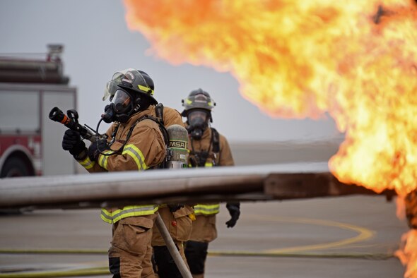 A U.S. Air Force firefighter assigned to the 8th Civil Engineer Squadron prepares to conduct live fire training at Kunsan Air Base, Republic of Korea, Feb. 13, 2020. Live aircraft fire training ensures 8th CES firefighters are proficient in the steps needed to properly fight aircraft fires. (U.S. Air Force photo by Staff Sgt. Anthony Hetlage)