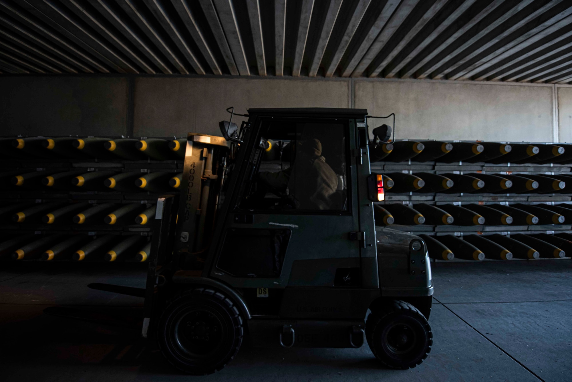 U.S. Air Force Airman 1st Class Matt Amato, 86th Munitions Squadron munitions stockpile management technician, operates a forklift while moving crates of munitions into a storage facility at Ramstein Air Base, Germany, Feb. 6, 2020. Approximately 200 containers have been downloaded and stored in the MUNS area to further strengthen the firepower that can be delivered to the three combatant commands in the area of operation.