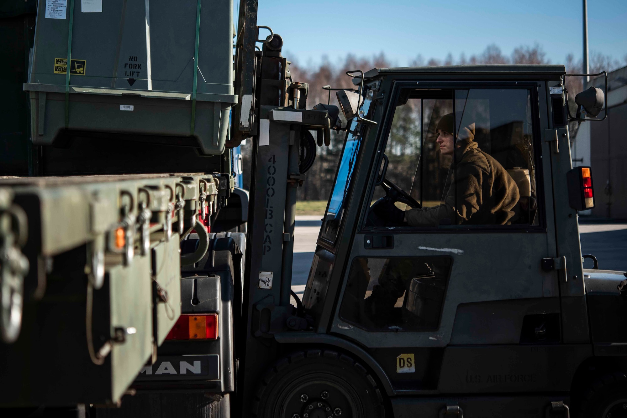 U.S. Air Force Airman 1st Class Matt Amato, 86th Munitions Squadron munitions stockpile management technician, ensures proper placement of crates containing inert munitions in a storage facility at Ramstein Air Base, Germany, Feb. 6, 2020. The 86th MUNS provides support to generate and employ air mobility enabling air and space power projection by storing, packaging and shipping the munitions to three combatant commands. (U.S. Air Force photo by Staff Sgt. Devin Nothstine)