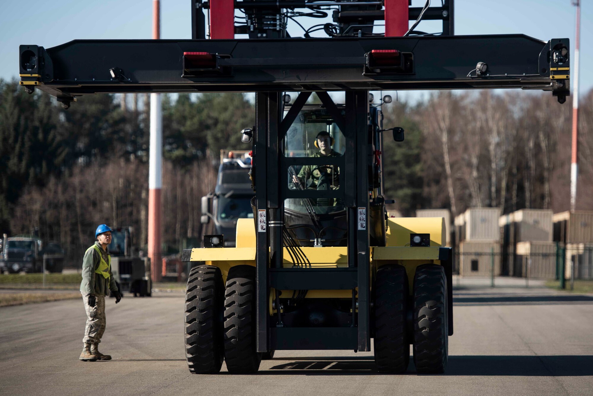 A U.S. Airman assigned to the 86th Munitions Squadron operates a “super stacker” forklift while transporting munitions at Ramstein Air Base, Germany, Feb. 6, 2020. The super stacker forklift allows Airmen to unload crates of munitions from semi-trucks safely and efficiently. (U.S. Air Force photo by Staff Sgt. Devin Nothstine)