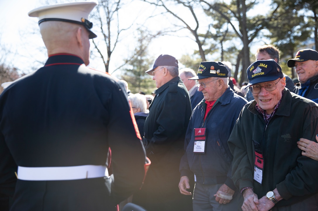 The 19th Sergeant Major of the Marine Corps, Sgt. Maj. Troy E. Black greets World War II veterans attending a wreath laying ceremony in honor of the 75th anniversary of the battle of Iwo Jima at the Marine Corps War Memorial in Arlington, V.A., Feb. 27, 2020. The Marine Corps hosted the ceremony to honor the veterans of World War II with speeches by the Commandant of the Marine Corps and the Sergeant Major of the Marine Corps. The warrior spirit demonstrated by Marines and sailors of yesterday fuel the tradition of warfighters engaging in today’s battlespace. (U.S. Marine Corps photo by Sgt. Victoria Ross)