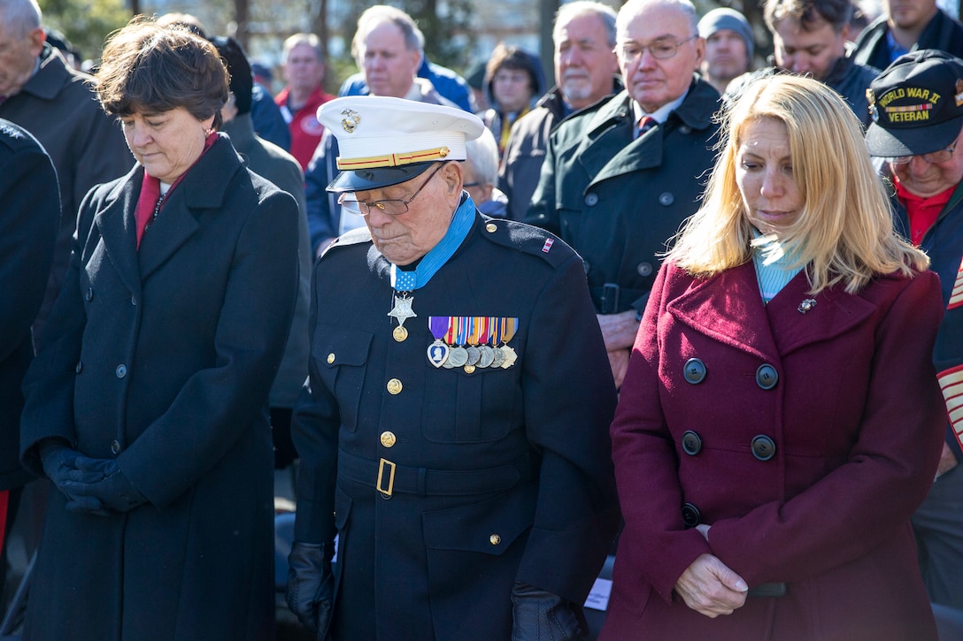 Hershal “Woody” Williams, a veteran of World War II and Medal of Honor recipiant is flanked Mrs. Donna Berger (left) and by Mrs. Stacie Black (right) at a wreath laying ceremony held in honor of the 75th anniversary of the battle of Iwo Jima at the Marine Corps War Memorial in Arlington, V.A., Feb. 27, 2020. The Marine Corps hosted the ceremony to honor the veterans of World War II with speeches by the Commandant of the Marine Corps and the Sergeant Major of the Marine Corps. The warrior spirit demonstrated by Marines and sailors of yesterday fuel the tradition of warfighters engaging in today’s battlespace. (U.S. Marine Corps photo by Sgt. Victoria Ross)