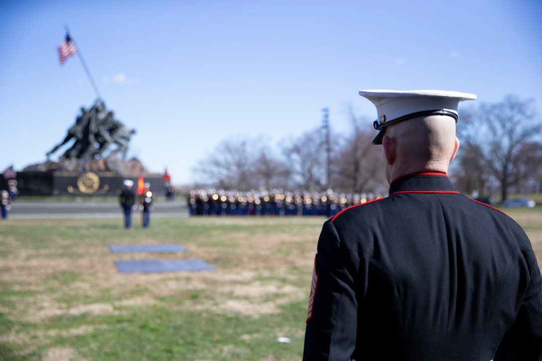 The 19th Sergeant Major of the Marine Corps, Sgt. Maj. Troy E. Black stands at attention during a wreath laying ceremony in honor of the 75th anniversary of the battle of Iwo Jima at the Marine Corps War Memorial in Arlington, V.A., Feb. 27, 2020. The Marine Corps hosted the ceremony to honor the veterans of World War II with speeches by the Commandant of the Marine Corps and the Sergeant Major of the Marine Corps. The warrior spirit demonstrated by Marines and sailors of yesterday fuel the tradition of warfighters engaging in today’s battlespace. (U.S. Marine Corps photo by Sgt. Victoria Ross)
