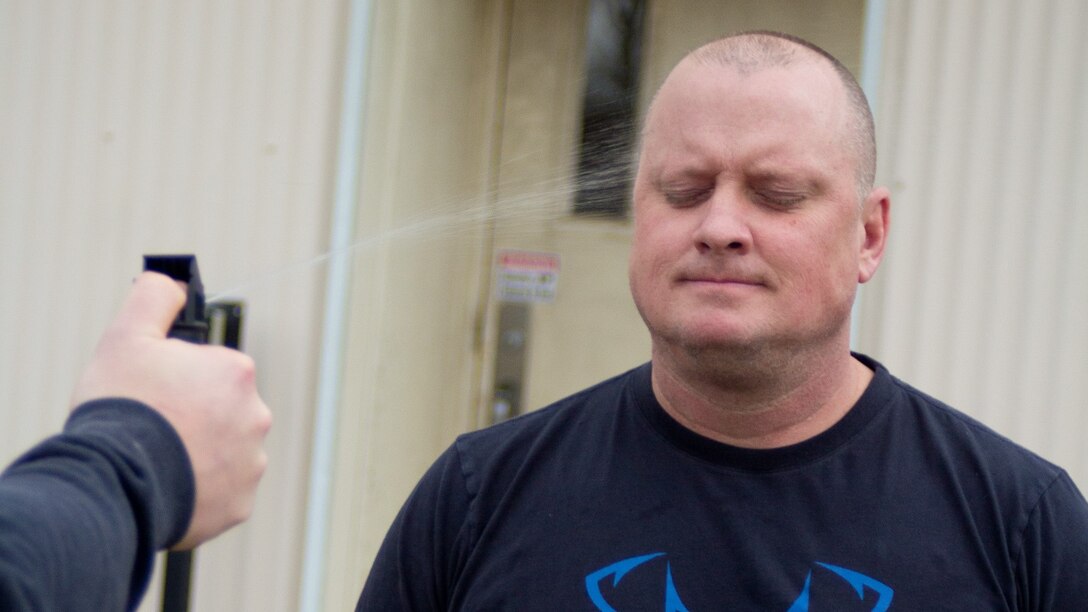 A security guard from the U.S. Army Engineer Research and Development Center’s Construction Engineering Research Laboratory, is sprayed with Oleoresin Capsicum Aerosol, or “pepper spray,” during a Department of the Army Security Guards Mobile Training Team Train-the-Trainer Course.