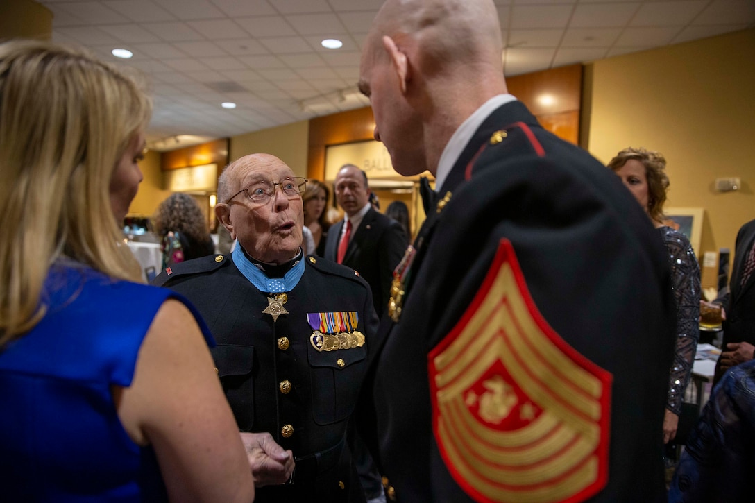 The 19th Sergeant Major of the Marine Corps, Sgt. Maj. Troy E. Black, greats Medal of Honor recipient Hershal “Woody” Williams at the Iwo Jima 75th Anniversary Gala in Arlington, V.A., Feb. 29, 2020. The event was hosted by the Iwo Jima Association of America to bring veterans together through shared experiences to honor their service and to remember those that gave the ultimate sacrifice. (U.S. Marine Corps photo by Sgt. Victoria Ross)