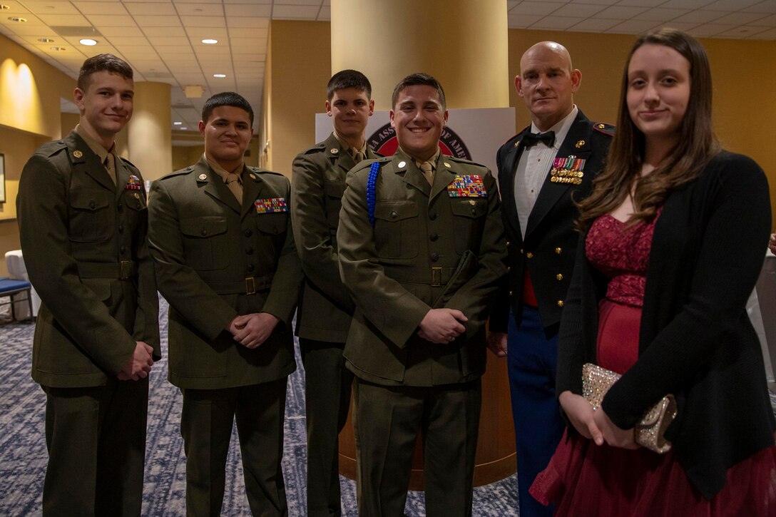 The 19th Sergeant Major of the Marine Corps, Sgt. Maj. Troy E. Black, stands for a photo with young men and women of the young Marine program at the Iwo Jima 75th Anniversary Gala in Arlington, V.A., Feb. 29, 2020. The event was hosted by the Iwo Jima Association of America to bring veterans together through shared experiences to honor their service and to remember those that gave the ultimate sacrifice. (U.S. Marine Corps photo by Sgt. Victoria Ross)