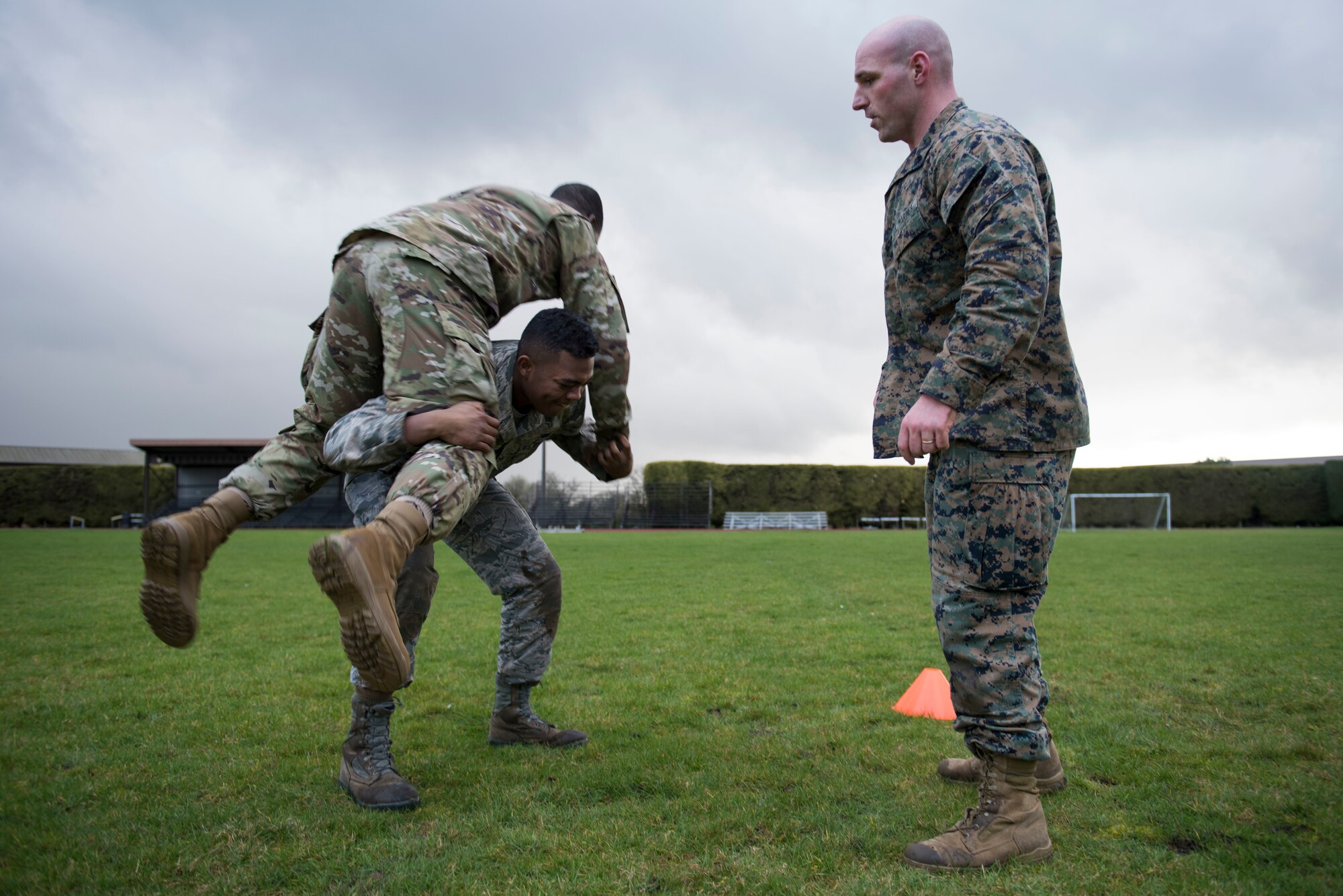 U.S. Air Force Airman 1st Class Andrew Cauley, Detachment 5 Aerial Mail Terminal mail processing specialist lifts and carries U.S. Air Force Senior Airman David States Jr., 423rd Security Forces Squadron installation entry controller, during a practice Marine Corps Combat Fitness Test at the Joint Immersion Day at RAF Alconbury, England, Feb. 20, 2020. Joint Immersion Day was an opportunity for Air Force, Army, Marines and Navy, to come together to learn about each branch’s history, culture, structure and evaluations, in order to be aware of our similarities, differences, and needs in a joint environment. (U.S. Air Force photo by Airman 1st Class Jennifer Zima)