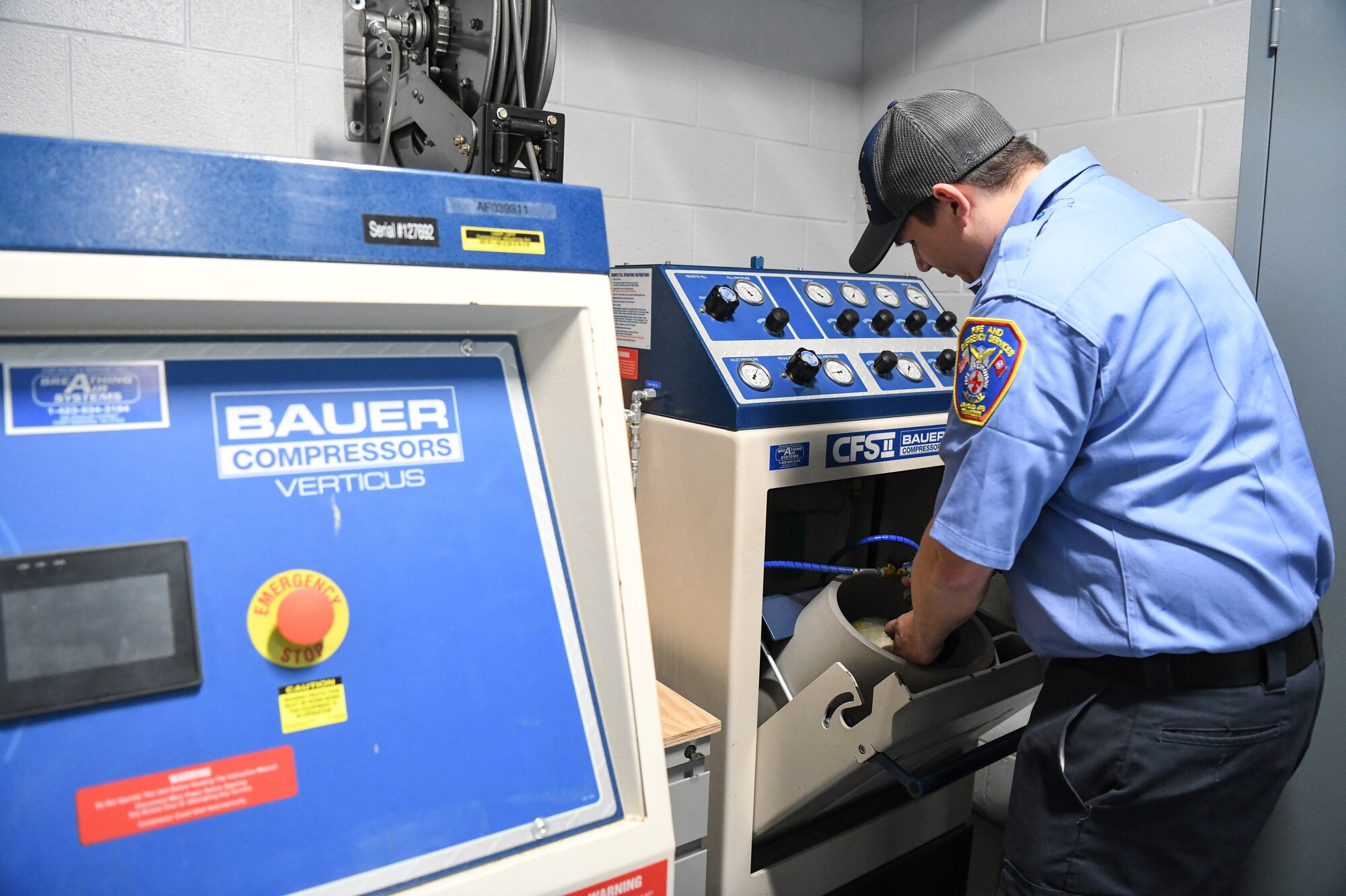 Chris Elsen, a firefighter with Arnold Air Force Base Fire and Emergency Services, demonstrates refilling an air tank Jan. 21, 2020, at the Arnold AFB FES station. A recently-completed addition to the station allowed the equipment used to refill air tanks and perform maintenance on the self-contained breathing apparatus equipment to be relocated inside the station from an outbuilding. (U.S. Air Force photo by Jill Pickett)