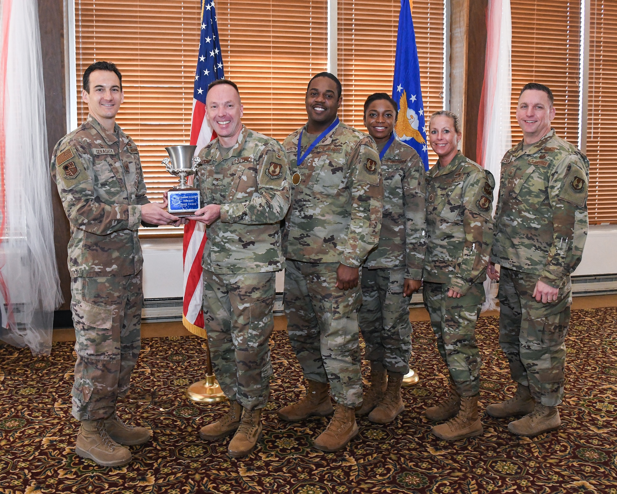 Arnold Engineering Development Complex Commander Col. Jeffrey Geraghty presents the Spirit Award to Col. Charles Roberts, chief of the Test Support Division during the annual awards breakfast Feb. 21, 2020, at the Arnold Lakeside Center at Arnold Air Force Base, Tenn. Also pictured from left are Master Sgt. Ricardo Hollingsworth II, Tech Sgt. Alexisa Humphrey, Master Sgt. Beverly Spademan and AEDC Superintendent Chief Master Sgt. Robert Heckman. (U.S. Air Force photo by Jill Pickett)