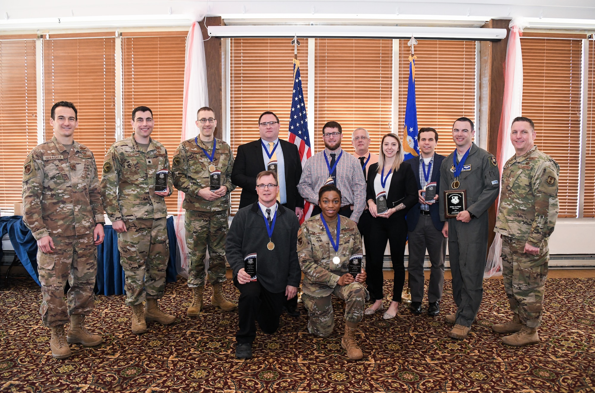 Arnold Engineering Development Complex Annual Awards winners pose for a photo with AEDC leadership Feb. 21, 2020, after the celebratory breakfast at the Arnold Lakeside Center at Arnold Air Force Base, Tenn. Pictured back row from left are AEDC Commander Col. Jeffrey Geraghty, Lt. Col. John McShane standing in for deployed winner Capt. Jonathan Gutierrez, Maj. Wesly Anderson, Marcus Conner, Chris Fanning, John Garner, McKinley Katz, Yancee Burchett, Maj. Bryan Ralston, AEDC Superintendent Chief Master Sgt. Robert Heckman; and front row from left, Brian Barlow and Tech Sgt. Alexisa Humphrey. (U.S. Air Force photo by Jill Pickett)