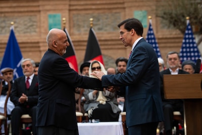 Defense Secretary Dr. Mark T. Esper shakes hands with Afghan President Ashraf Ghani in Kabul, Afghanistan, Feb. 29, 2020.