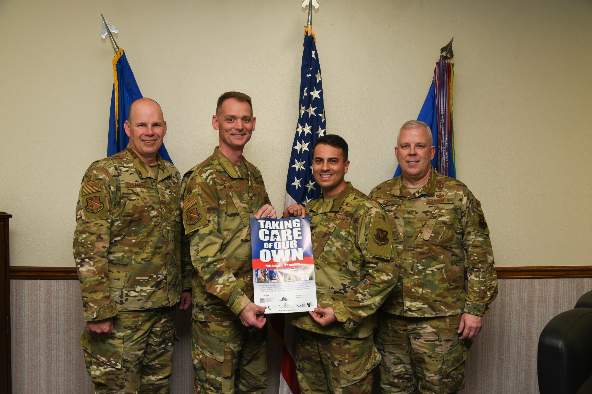 Lt. Allan Rodriguez of the Air Force Assistance Fund poses with Wing Leadership at Kirtland Air Force Base, New Mexico, Feb. 28, 2020. The AFAF is an annual campaign that raises funds for charities that provide support to the Air Force family in need. (U.S. Air Force photo by Staff Sergeant Enrique Barceló)