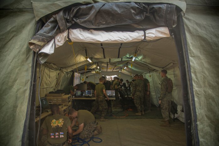 U.S. Marines with Marine Air Support Squadron 2, 1st Marine Aircraft Wing, set up wiring and computer workstations for a direct air support center as part of Exercise Cobra Gold 2020 at Camp Phra Maha Jetsadaratchao, Chon Buri, Kingdom of Thailand, Feb. 26.