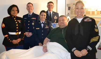 Retired Col. Del Powell, 7th Rangers, was happy to receive the Military Ambassadors visit at the Audie L. Murphy Veterans Memorial Hospital during the National Salute to Veterans Feb. 14. Powell stated he had not received any visitors during the time he had been at the hospital and was getting lonely.