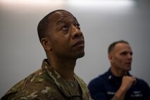 Chief Master Sgt. Cedric Nettles, 628th Mission Support Group superintendent, looks at a C-17 Globemaster III engine during a tour at Joint Base Charleston, S.C., Feb. 27, 2020.