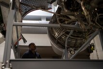 Command Senior Chief Petty Officer Jaz Davis, Citadel ROTC command senior enlisted leader, looks at a C-17 Globemaster III engine during a tour at Joint Base Charleston, S.C., Feb. 27, 2020.