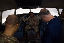 Tech. Sgt. Julius Caluya, 373rd Training Squadron Detachment 5 instructor, gives a tour of a C-17 Globemaster III simulator at Joint Base Charleston, S.C., Feb. 27, 2020.