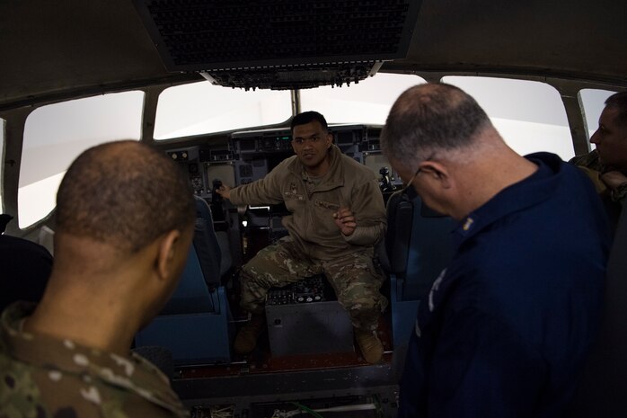 Tech. Sgt. Julius Caluya, 373rd Training Squadron Detachment 5 instructor, gives a tour of a C-17 Globemaster III simulator at Joint Base Charleston, S.C., Feb. 27, 2020.