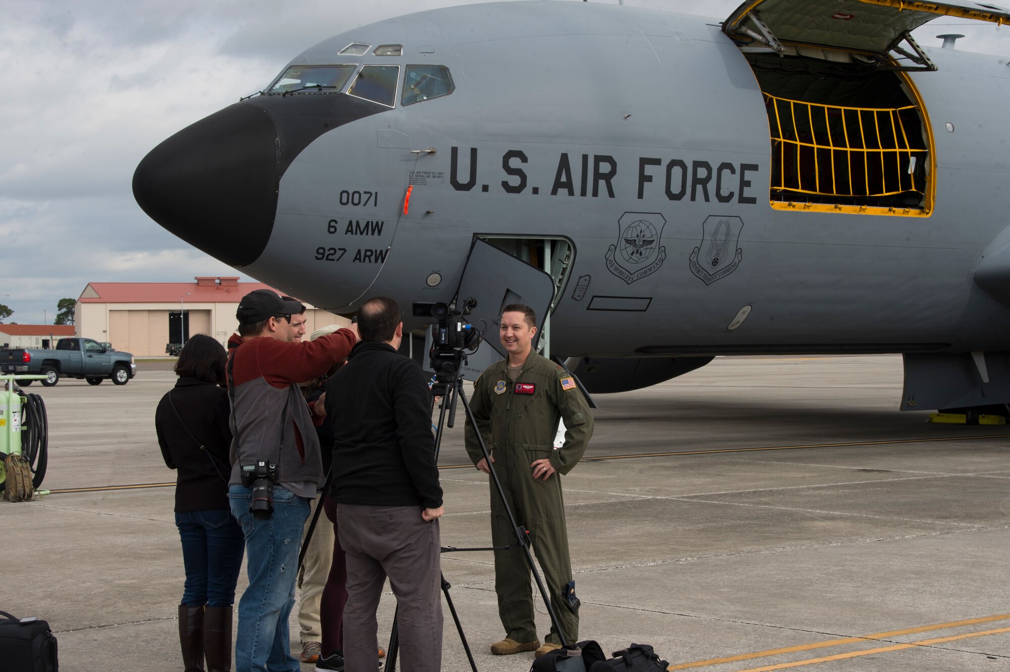 U.S. Air Force Maj. Justin Kellett, the Tampa Bay AirFest 2020 director, conducts an interview with media Feb. 27, 2020, on the flight line at MacDill Air Force Base, Fla. Representatives from the Tampa Bay area flew on a KC-135 Stratotanker aircraft, during an air refueling training exercise, to promote AirFest 2020 and inform the community about the mission at the 6th Air Refueling Wing.