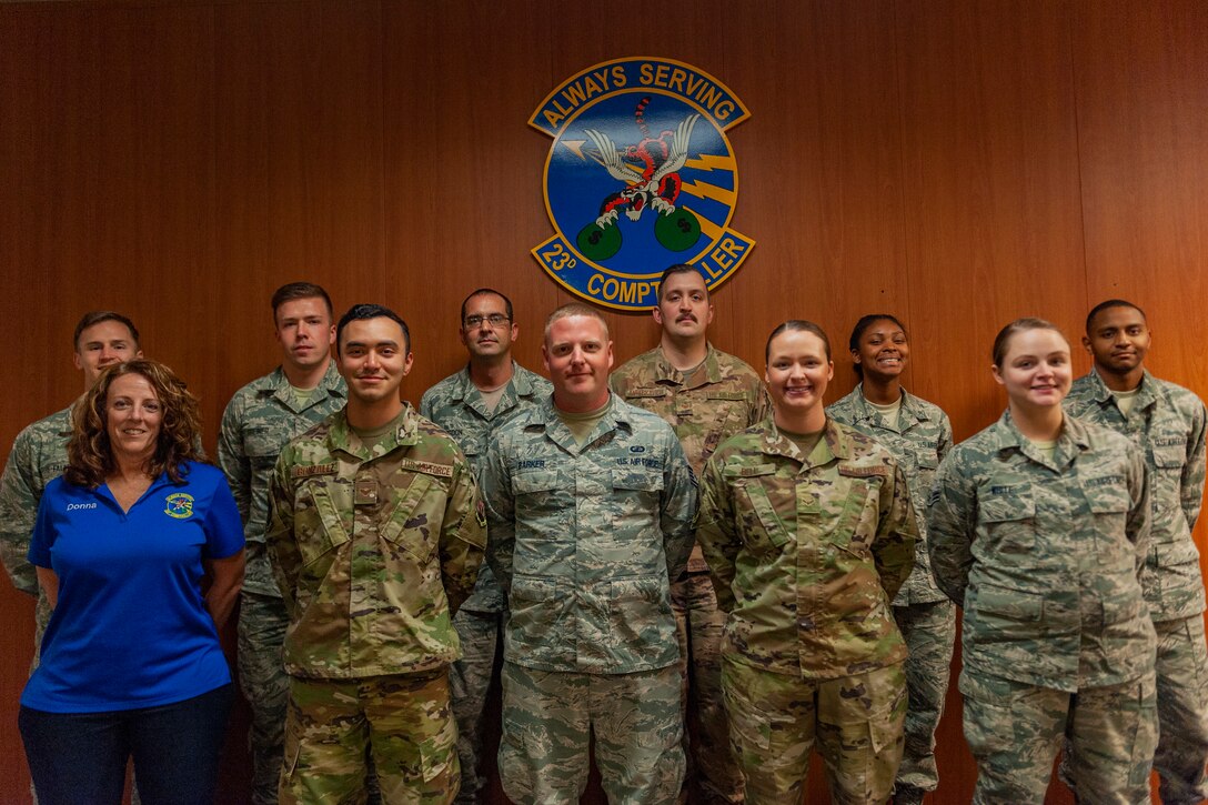Photo of finance Airmen posing