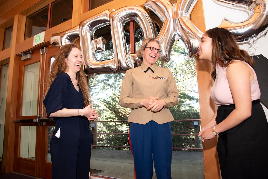 Marine Corps Maj. Julia Weber, center, a Naval Postgraduate School Operations Research student, engages with Sarah Sallee, left, and Audrey Avelino, right, who are part of the Speaker Curation Team at Santa Catalina School, an all-girls college prep boarding and day school in Monterey, Calif., during the school’s TEDx speaking event where Weber is slated to deliver remarks regarding her experience while working at the U.S. Embassy in Islamabad, Pakistan, Feb. 12, 2020. This event marks the 7th annual TEDx event hosted, led and streamed live by a student-run club at the school. The theme for this year’s event is “Picture This” – “all great ideas and innovations start with a single thought–a dream–and perhaps just a simple one. It is ideas coupled with action that shape the present and make a change.”
The TEDx event aims to share the ideas within the local community that can change the world for the better. Weber is one of seven speakers from the around the Monterey community. During Weber’s time working in the U.S. Embassy in Pakistan, she saw a need to improve the conditions of stray animals. By rallying other foreign diplomats in Pakistan, she founded the nonprofit organization Islamabad PAWS (Pakistan Animal Welfare Society) in 2017. Islamabad PAWS is dedicated to improving the conditions of stray and abandoned dogs. In her heartwarming and inspiring talk titled, “What Do You See,” Weber shares her thoughts on leadership, being a global citizen, and seeing and answering the call to lead in innovative ways. Weber attended Mount Holyoke College where the first women cadets were sworn into the U.S. Marine Corps in 1943.