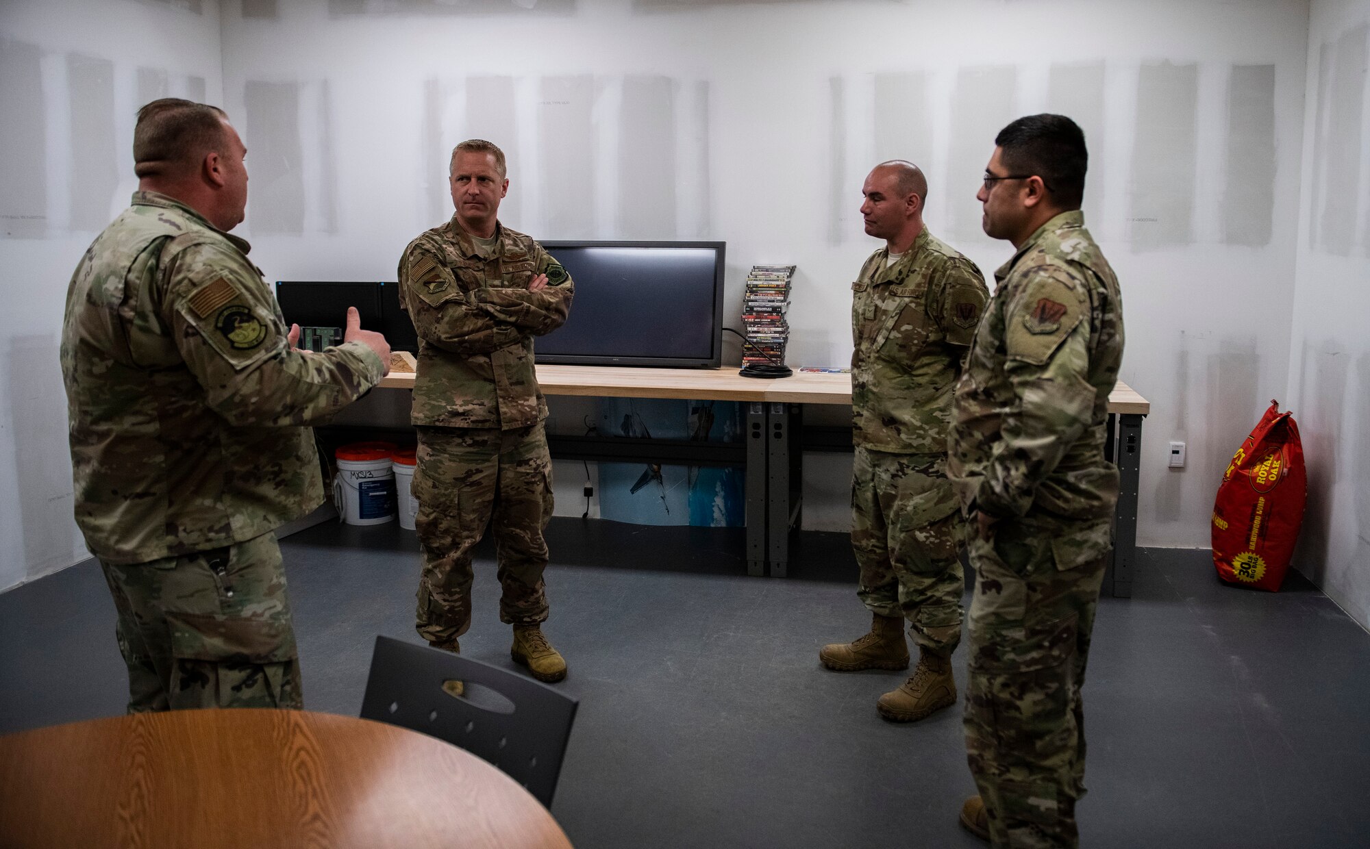 U.S. Air Force Master Sgt. Michael Stout, 325th Maintenance Squadron noncommissioned officer in charge of low observable, tells Col. Brian Laidlaw, 325th Fighter Wing commander, about some of the accomplishments of Airman 1st Class Orin Pickering, 325 MXS low observable journeyman, during an Airman Shadow at Tyndall Air Force Base, Florida, Feb. 28, 2020. Laidlaw shadowed Pickering to see what a typical duty day in low observable was like and worked side-by-side with him. (U.S. Air Force Photo by Senior Airman Stefan Alvarez)