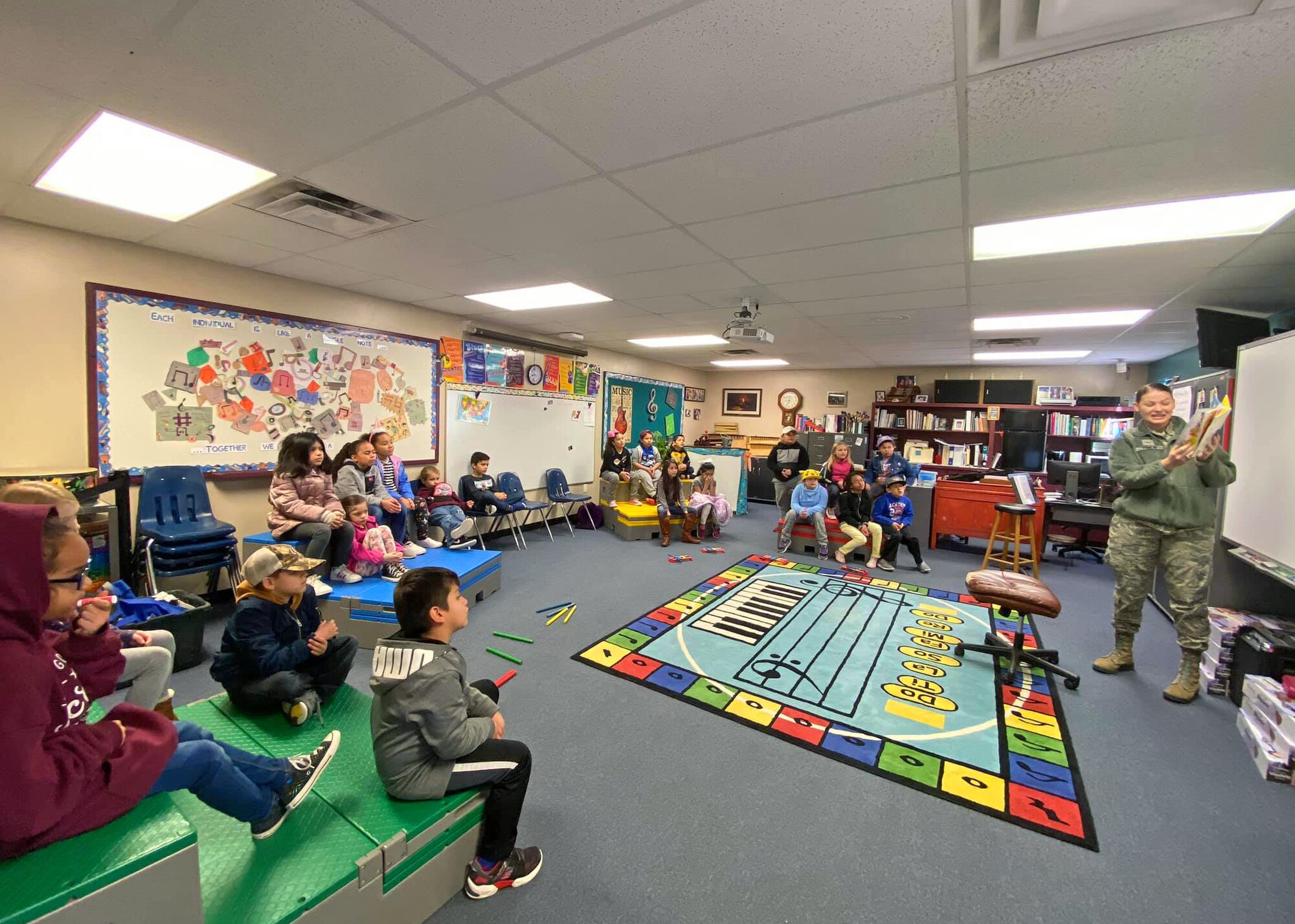 U.S. Air Force Airman 1st Class Rachel Tomlin, 17th Force Support Squadron customer support technician, reads to a class at McGill Elementary School, San Angelo, Texas, Feb. 27, 2020. (Courtesy photo)