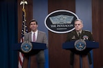 Defense Secretary Dr. Mark T. Esper and Army Gen. Mark A. Milley stand next to each other at lecterns.