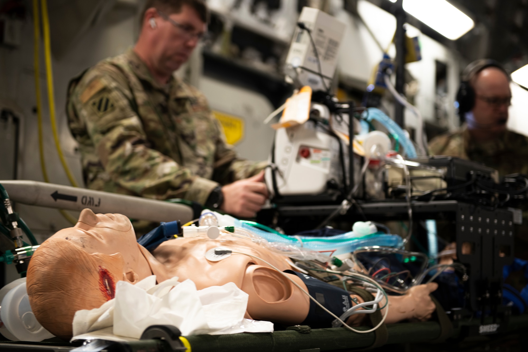 A U.S. Air Force CCATT (Critical Care Air Transport Team) crew assigned to multiple Air National Guard units provide in-flight medical care to a trauma training manikin on board of a C-17 Globemaster during Patriot South 2020 at the Gulfport Combat Readiness Training Center in Gulfport, Miss., Feb. 27, 2020.  PATRIOT is a Domestic Operations disaster-response training exercise conducted by National Guard units working with federal, state and local emergency management agencies and first responders. (U.S. Air National Guard photo by Technical Sgt. L. Roland Sturm)