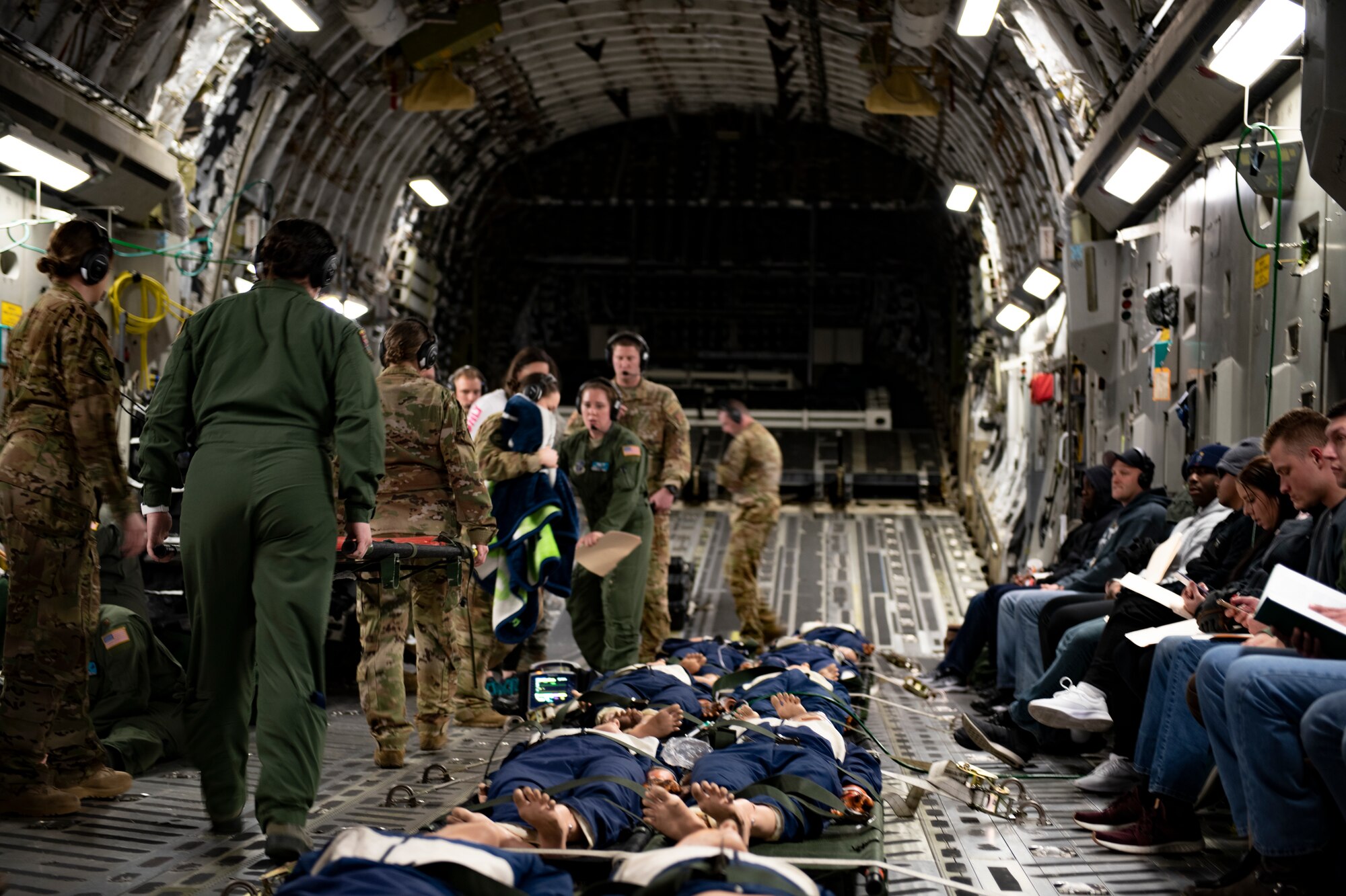 U.S. Air Force medical personnel assigned to multiple Air National Guard units respond to a simulated in-flight medical emergency on board of a C-17 Globemaster during Patriot South 2020 at the Gulfport Combat Readiness Training Center in Gulfport, Miss., Feb. 27, 2020.  PATRIOT is a Domestic Operations disaster-response training exercise conducted by National Guard units working with federal, state and local emergency management agencies and first responders. (U.S. Air National Guard photo by Technical Sgt. L. Roland Sturm)