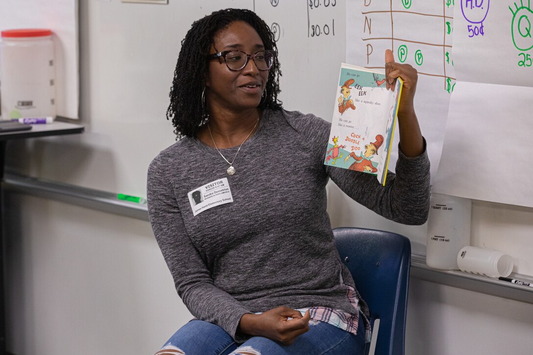 Norfolk Naval Shipyard employee Sandra Demetrius participated in Read Across America Day at James Hurst Elementary School Mar. 2. Read Across America Day, an observance on the school day closest to Dr. Seuss' birthday, is part of a year-long program focused on motivating children and teens to read. The program is led by the National Education Association (NEA), focusing on building a nation of readers one story at a time.