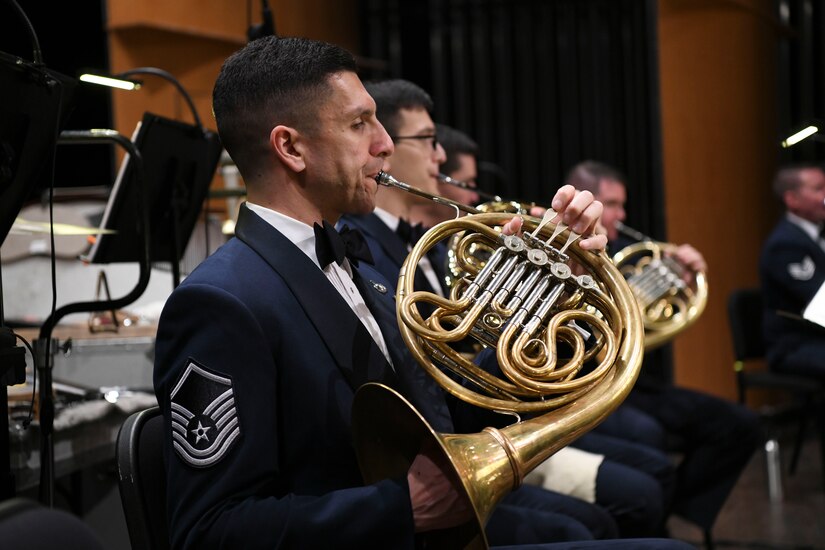 Master Sgt. David Balandrin, U.S. Air Force Concert Band French hornist, performs during the Guest Concert Series at the Rachel M. Schlesinger Concert Hall and Arts Center in Alexandria, Va., Feb. 20, 2020. The band has five assigned French horn players and over 15 different instruments apart of the ensemble. (U.S. Air Force photo by Airman 1st Class Spencer Slocum)