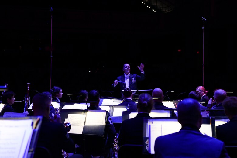 Col. Don Schofield, The United States Air Force Band commander and conductor, conducts during the Guest Concert Series at the Rachel M. Schlesinger Concert Hall and Arts Center in Alexandria, Va., Feb. 20, 2020. The concert featured the United States Air Force Concert Band, members of the Singing Sergeants and their guest performer, Samantha Massell. (U.S. Air Force photo by Airman 1st Class Spencer Slocum)