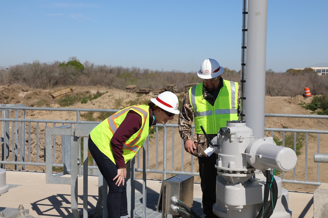 HOUSTON (Feb. 28, 2020)—Alison Pieper, water control manager with the Galveston District Water Management Team and Byron Smith, civil engineer technician with the Houston Project Office inspect an operator on the new water control structures at Barker Dam. 
The new structures were placed into use on Feb. 14 as part of a multi-year, $75 million dam safety contract that will improve the robustness, redundancies and resiliency of both Addicks and Barker dams and reservoirs.