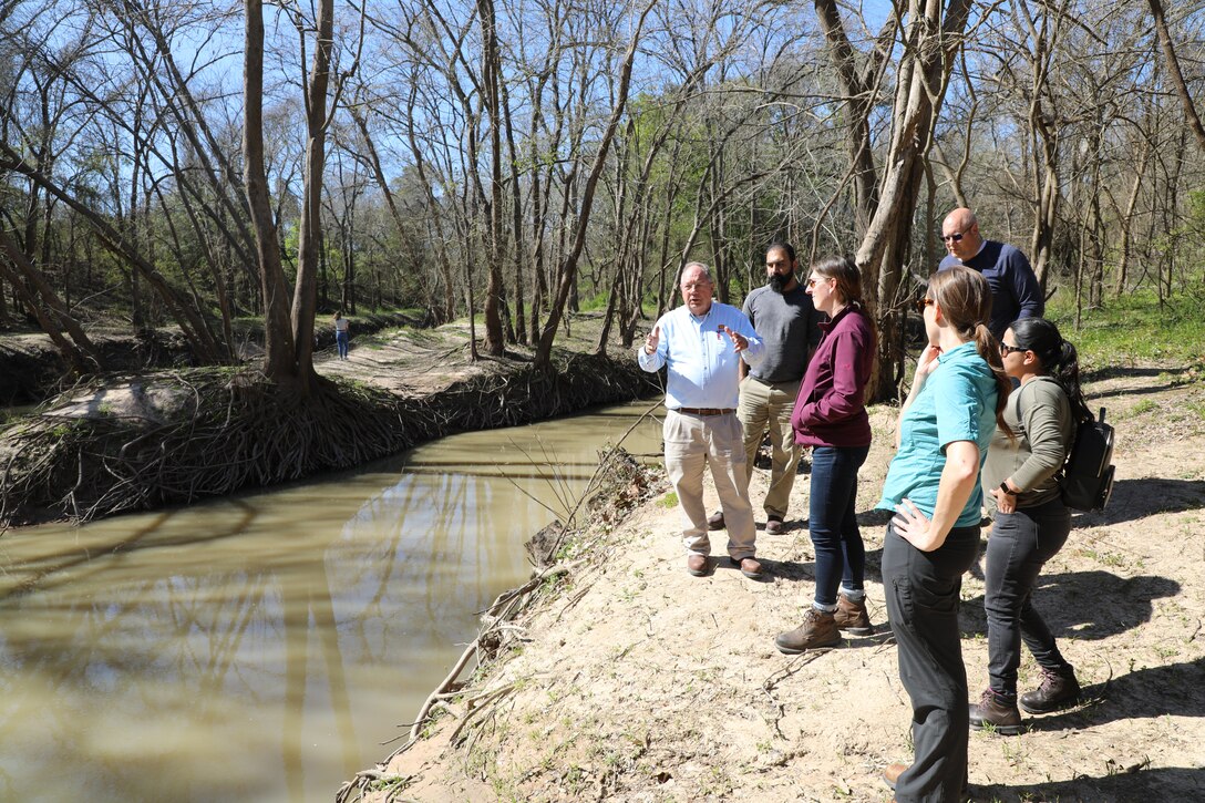 HOUSTON (Feb. 28, 2020) –Richard Long, natural resource management specialist with the Houston Project Office of the U.S. Army Corps of Engineers Galveston District, discusses the confluence of Buffalo Bayou and Langham Creek downstream of Addicks and Barker dams with members of the Water Management Team of the Galveston District. 

Sarah Delavan, chief of the Water Management Section, said "it is important for the team to have a clear understanding of how Addicks and Barker dams and reservoirs function from the top of the watershed to the Houston Ship Channel. What better way to obtain that