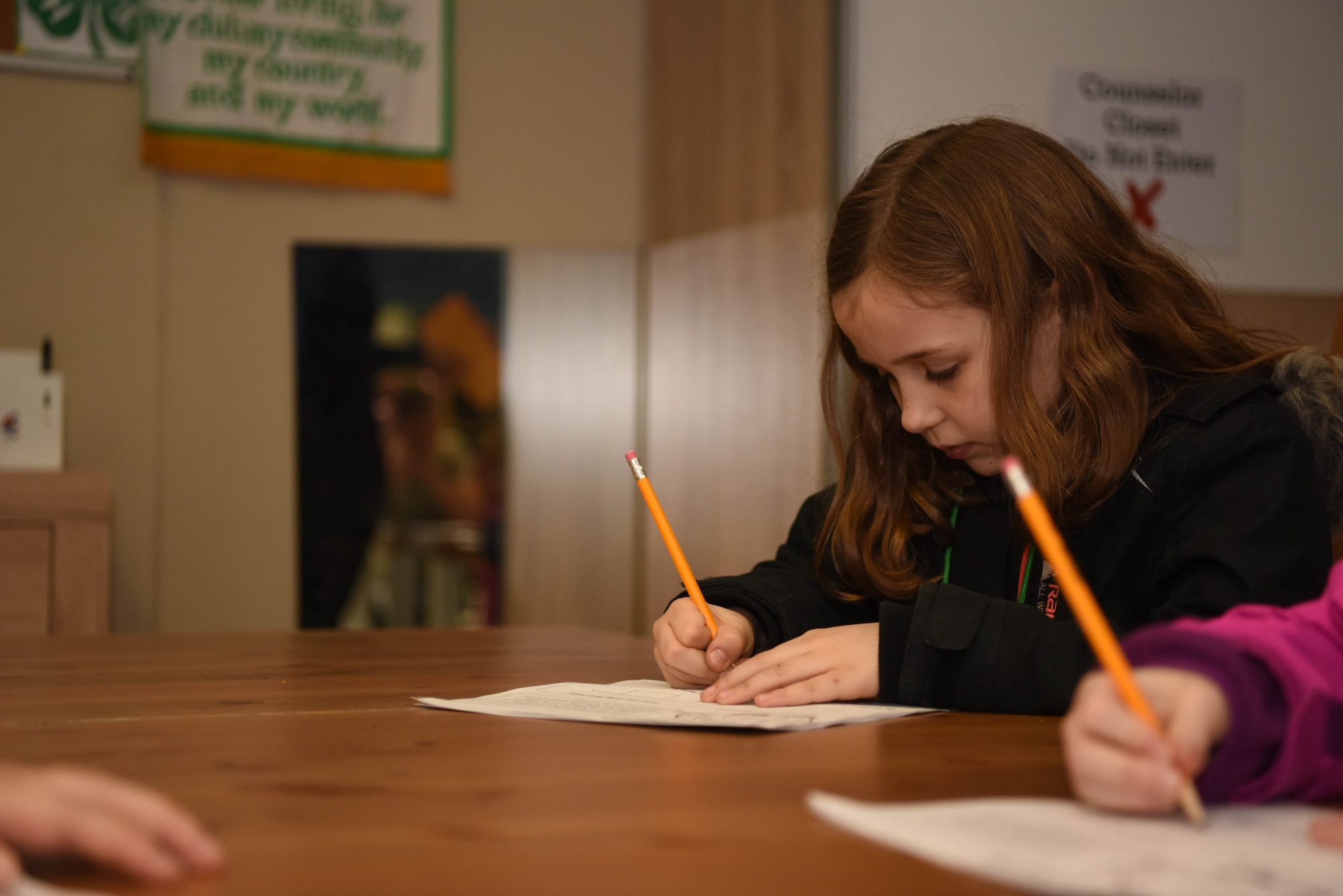 Peyton Dillard, daughter of U.S. Air Force Technical Sgt. Michael Dillard 86th Maintenance Group continuous process improvement manager, writes down goals she has for her money during the “Youth Saves Event,” at the School Age Program building at Ramstein Air Base, Germany, Feb. 25, 2020. Angelica Williams, 86th Force Support Squadron Airman and Family Readiness Center community readiness consultant said if she can show her students the importance of money early on, they may also realize the power of being debt-free later in their life. (U.S. Air Force photo by Senior Airman Kristof J. Rixmann)