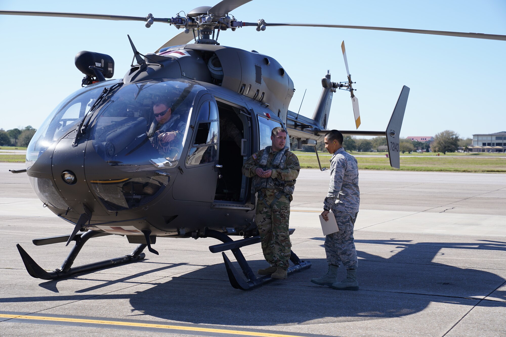 Two U.S. Army soldiers, Mississippi Army National Guard, prepare to transport a U.S. Air Force Airman acting as a patient during an exercise at Keesler Air Force Base, Mississippi, Feb. 27, 2020. The 81st Medical Group and the Mississippi Army National Guard worked together for an exercise, PATRIOT South, which involved transporting patients, in response to a simulated hurricane, from the Keesler Medical Center to the flightline where they would be airlifted to the Combat Readiness Training Center in Gulfport, Mississippi. "Exercises like this gives Keesler the opportunity to shape planning, assess and validate capabilities and address areas for improvement, making dragon medics more resilient during crisis situations," said Matthew Jalufka, 81st MDG medical emergency manager. (U.S. Air Force Airman 1st Class Kimberly L. Mueller)