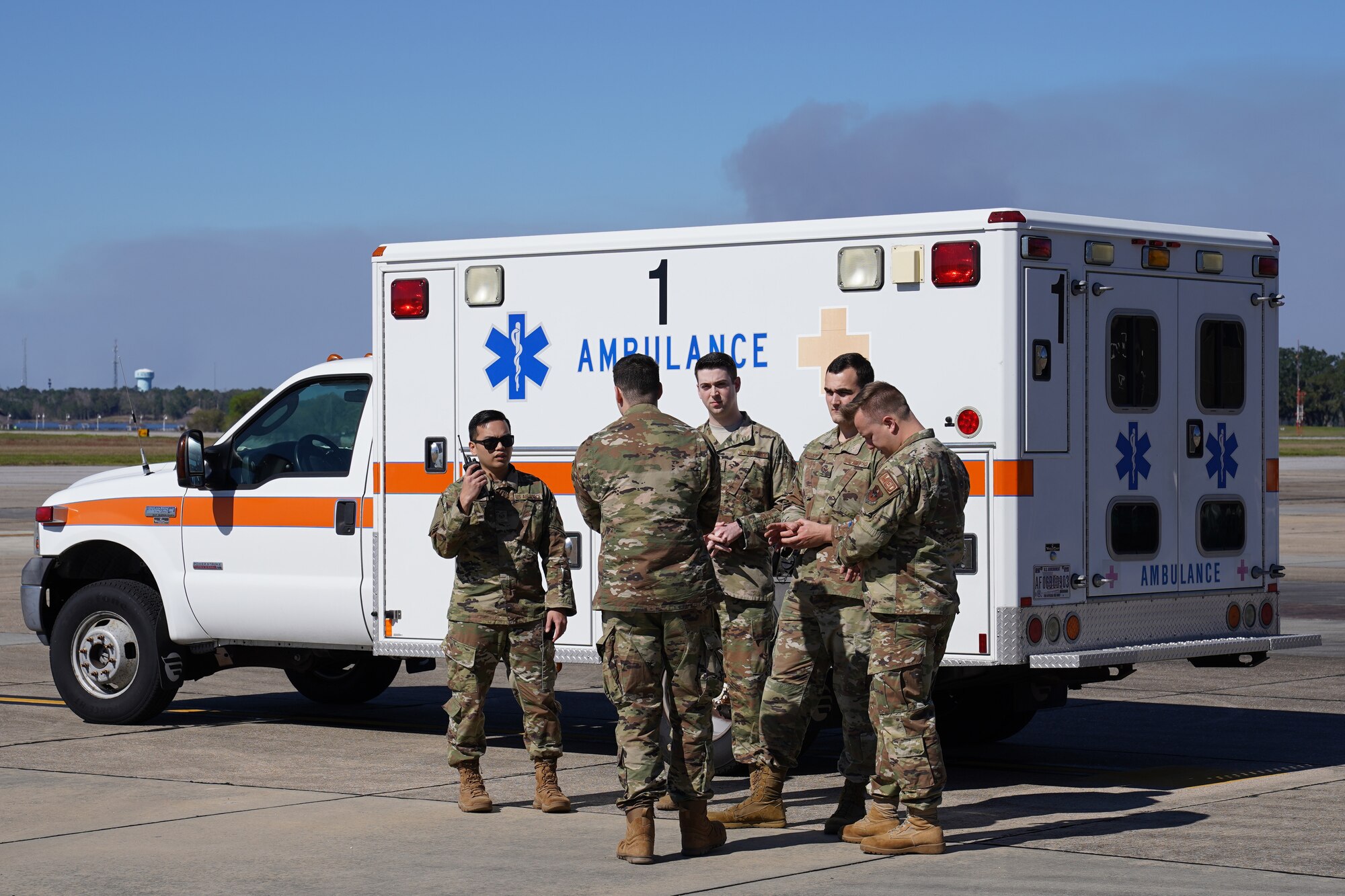 U.S. Air Force Airmen from the 81st Medical Group communicate with each other to figure out how to transport patients during an exercise at Keesler Air Force Base, Mississippi, Feb. 27, 2020. The 81st MDG and the Mississippi Army National Guard worked together for an exercise, PATRIOT South, which involved transporting patients, in response to a simulated hurricane, from the Keesler Medical Center to the flightline where they would be airlifted to the Combat Readiness Training Center in Gulfport, Mississippi. "Exercises like this gives Keesler the opportunity to shape planning, assess and validate capabilities and address areas for improvement, making dragon medics more resilient during crisis situations," said Matthew Jalufka, 81st MDG medical emergency manager. (U.S. Air Force Airman 1st Class Kimberly L. Mueller)