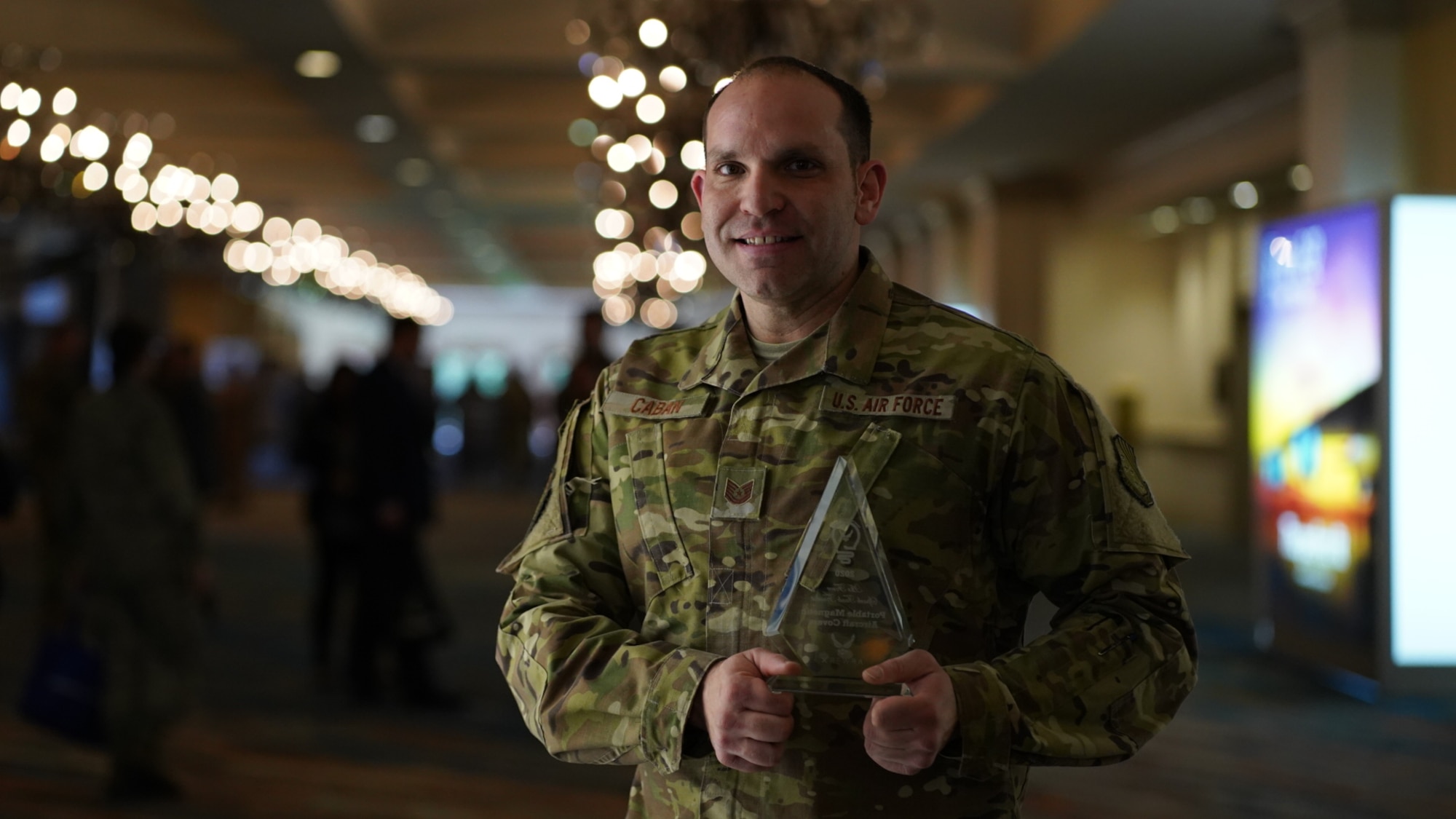 U.S. Air Force Tech. Sgt. Daniel Caban, 1st Aircraft Maintenance Squadron crew chief, poses with his Air Force Spark Tank Finalist award during the Spark Tank competition in Orlando, Florida, Feb. 28, 2020.