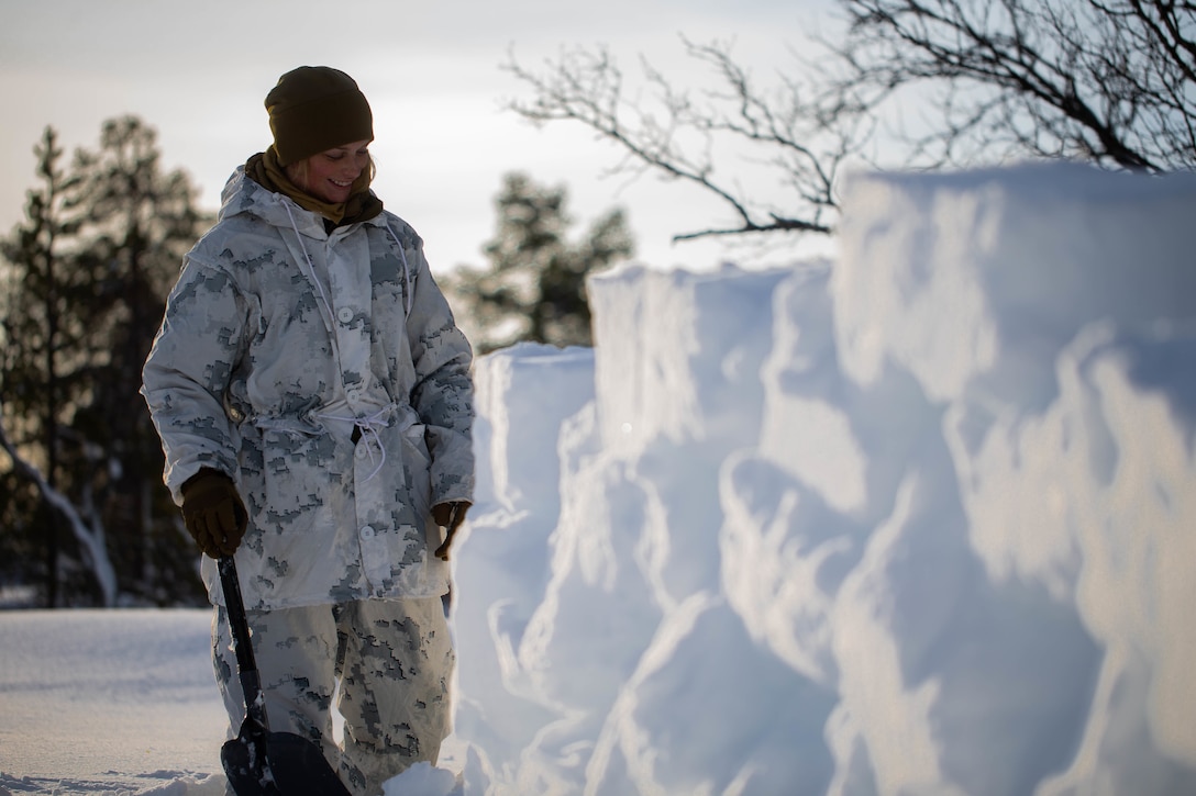 A U.S. Marine builds a snow wall during cold-weather training near Bjerkvik, Norway, Feb. 23.