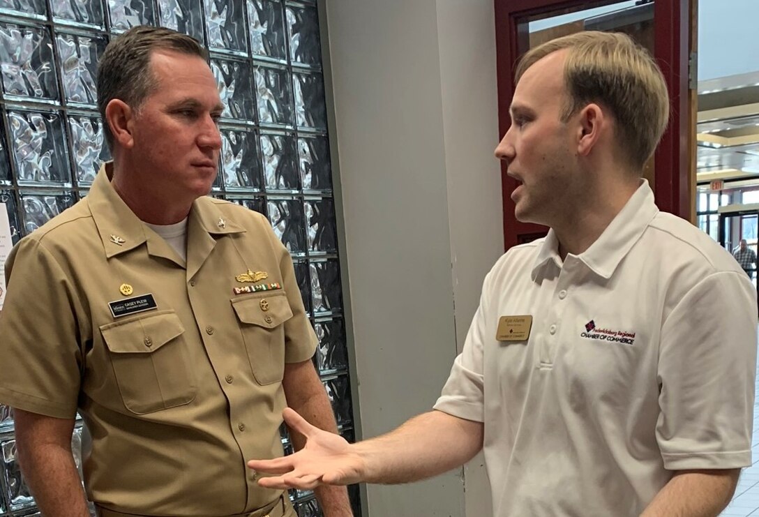 IMAGE: SPOTSYLVANIA, Va. (Feb. 29, 2020) – Capt. Casey Plew, Naval Surface Warfare Center Dahlgren Division (NSWCDD) commanding officer, speaks with Kyle Allwine, director of government affairs for the Fredericksburg Regional Chamber of Commerce, at the annual science, technology, engineering, mathematics (STEM) Summit open to the public at Chancellor High School. “Participating in STEM education is a valuable investment in both your future as well as society’s future,” Plew told students in his keynote speech. “Soak up the awesomeness of all of the different STEM efforts displayed for you. And get excited. One day, someone could be telling a future group of students about something amazing you developed – and it all started with you getting engaged in STEM at school.”